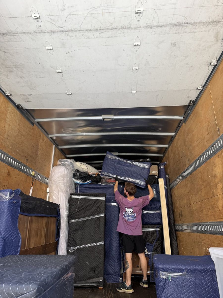 Furniture and boxes secured inside the Lynx Movers truck